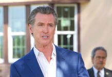 Billionaire Tax Whiplash Stuns California A government official speaking at an outdoor press conference