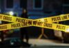 Strangled For Minutes—Then a Cold Cover-Up Police tape marking a crime scene with blurred figures in the background
