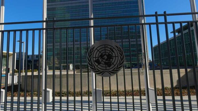 United Nations building with multiple international flags in front