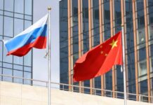 War Drills Tighten Beijing–Moscow Bond A fleet of military ships sailing in the ocean