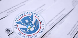 DHS Power Play Targets Welfare Green Cards Close-up of U.S. Department of Homeland Security seal on official documents