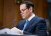 Rubio’s Crackdown Goes Nuclear Individual in a suit reviewing documents during a senate hearing