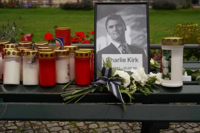 Berlin,,Germany,-,September,12,,2025:,Makeshift,Memorial,For,Charlie Memorial setup with candles, flowers, and a framed photograph