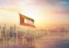 Kuwait Blames Iran—Tehran Points at Israel Kuwait flag flying over a modern city skyline at sunrise