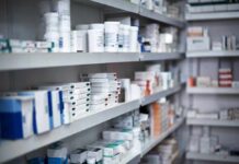 Assembly-Line Prescriptions? Judge Drops Hammer Shelves filled with various medication boxes and containers in a pharmacy