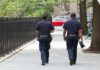 LA’s Cop Shortage Hits Alarming Low Two police officers walking on a city sidewalk