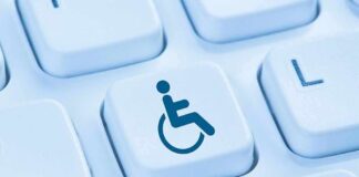 Shock DOJ Pivot Rattles Disability Rights Keyboard key with wheelchair accessibility icon
