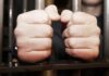 Juvenile Crew Terrorizes Bay Area hands gripping prison bars