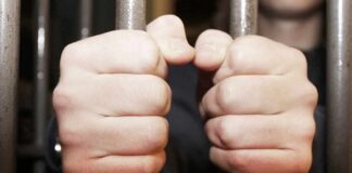 Juvenile Crew Terrorizes Bay Area hands gripping prison bars