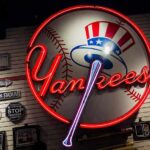 Neon Yankees sign on a wall of baseball memorabilia