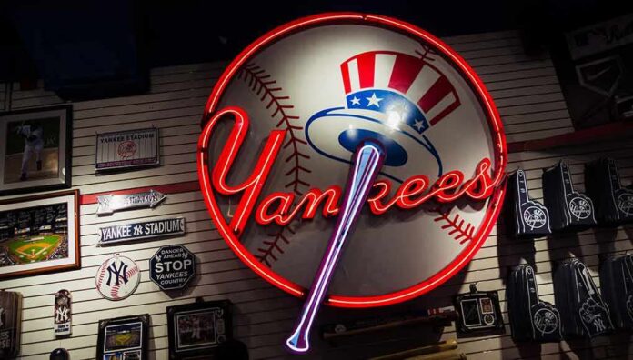 Neon Yankees sign on a wall of baseball memorabilia