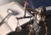 Lady Justice statue holding balanced scales