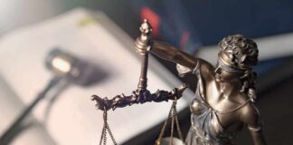 Lady Justice statue holding balanced scales