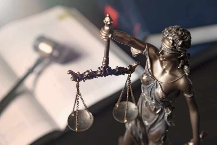 Lady Justice statue holding balanced scales