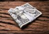 California’s $114M Bridge—Tickets Required Stack of U.S. dollar bills tied with a white cord