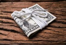 Stack of U.S. dollar bills tied with a white cord
