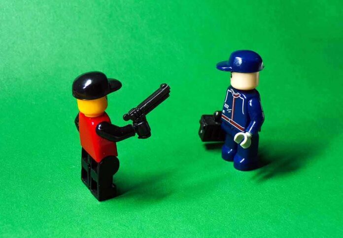 two lego minifigures facing each other on a green background
