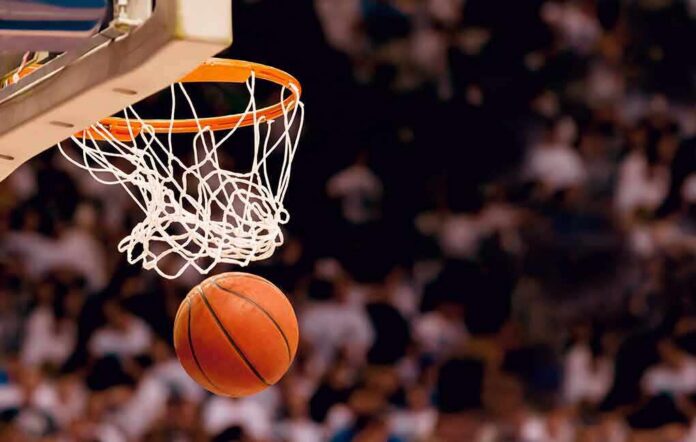 Basketball dropping through a hoop