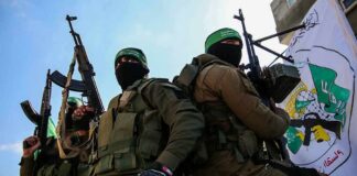 armed masked men in military gear holding rifles