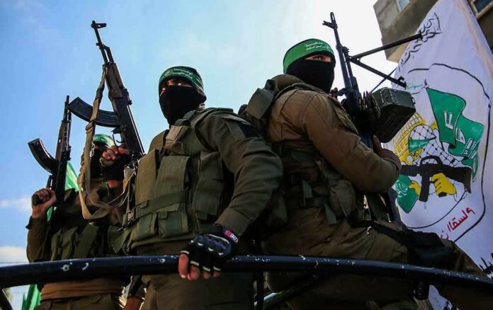 armed masked men in military gear holding rifles