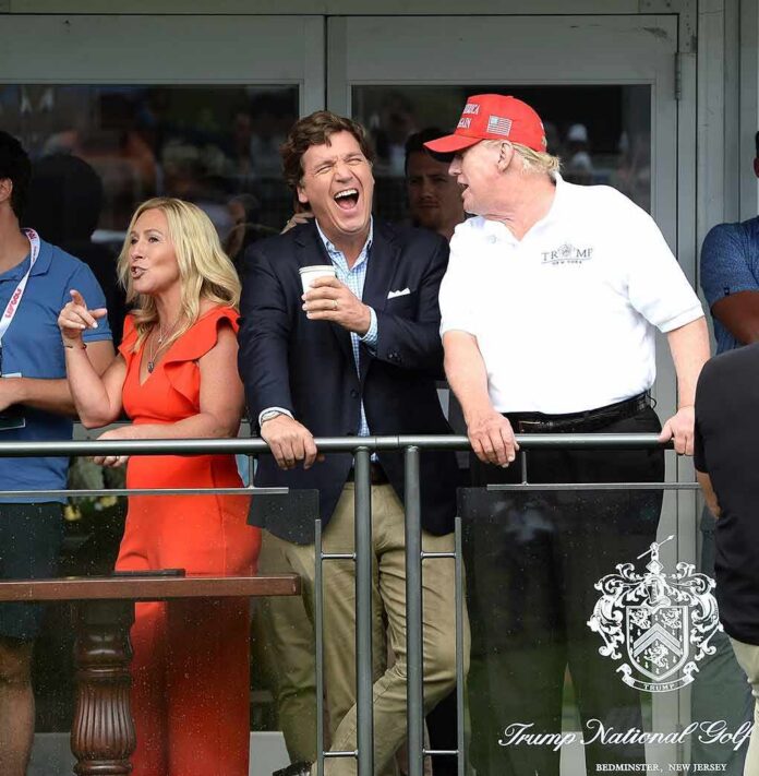 group of people on a balcony at a golf event