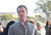 Newsom’s Michigan Gamble Backfires—What Did He Unleash? man in gray coat at an outdoor event