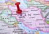 Red pushpin on a map of Iran