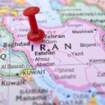 New Drone Armada Targets Iran’s Playbook Red pushpin on a map of Iran