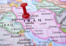 New Drone Armada Targets Iran’s Playbook Red pushpin on a map of Iran