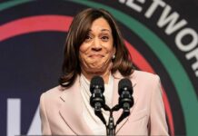 woman at podium with two microphones