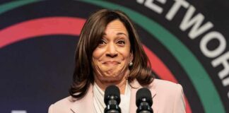 woman at podium with two microphones