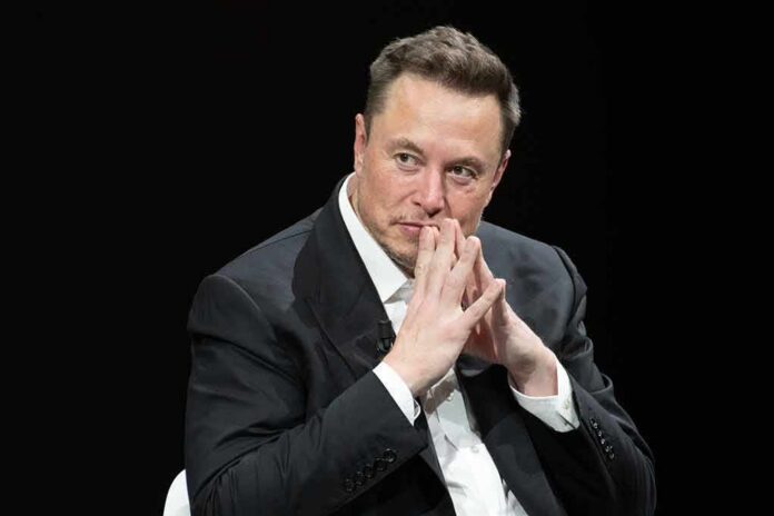 man in a suit with hands clasped thoughtfully
