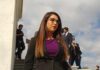Woman in business attire walking outdoors