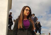 Woman in business attire walking outdoors