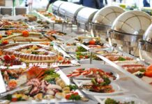 Buffet table with assorted seafood and salads