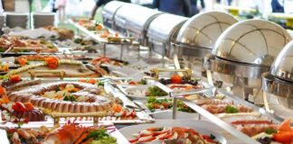 Buffet table with assorted seafood and salads