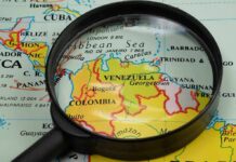 Venezuela Windfall Stalls—Deals Vanish Magnifying glass over a map of northern South America