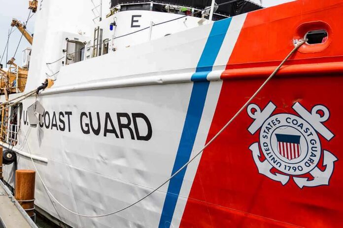 US Coast Guard ship hull with emblem and red stripe