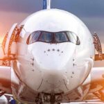 Front view of a commercial airplane on the tarmac