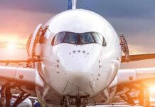 Packed Jet, High Pilot — What Was Inside? Front view of a commercial airplane on the tarmac