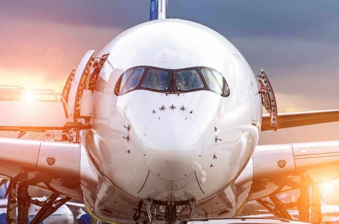 shutterstock_605697338 Front view of a commercial airplane on the tarmac