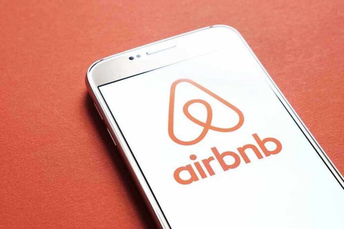 shutterstock_788160109 Airbnb logo on smartphone screen