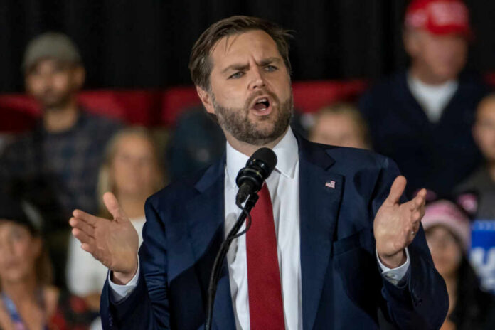 Man in suit speaking at a podium