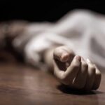 hand of a person lying on the floor