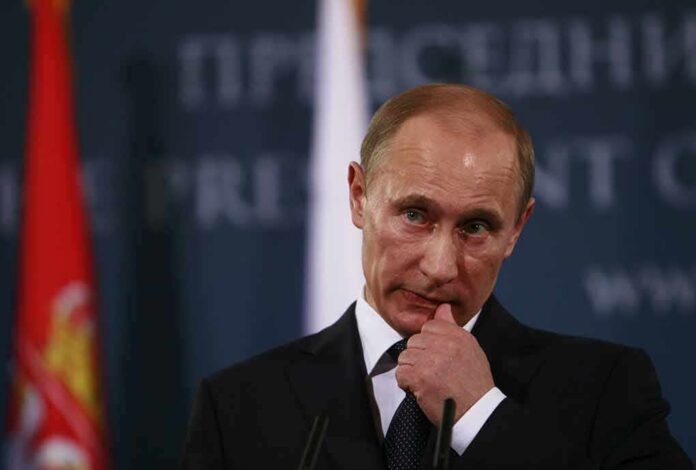 Vladimir Putin at a podium during a press event