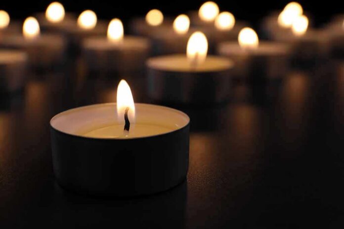 Tealight candle burning with soft glow