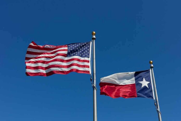 American and Texas flags waving on flagpoles