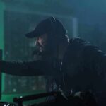 On-Device Key? Flock’s ‘Encryption’ Unraveled man with headset gestures while working at a control station