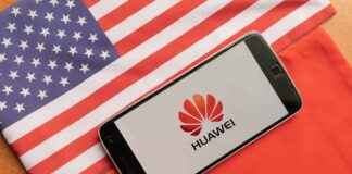 Huawei RICO Shock: ‘Culture Of Crime’ Exposed Smartphone displaying Huawei logo on U.S. and China flags