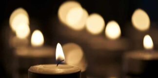 Tealight candle with soft glowing flame